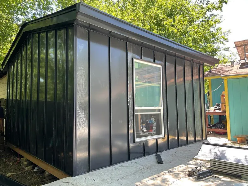 Black standing seam metal wall panels for Roof Inspection in Haltom City