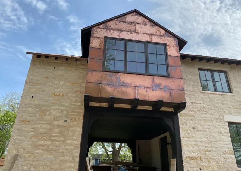 Copper metal panel facade on a stone building for Skylight Installation in Haltom City